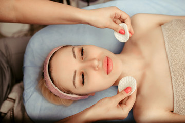 Obraz na płótnie Canvas face massage on woman in the spa salon