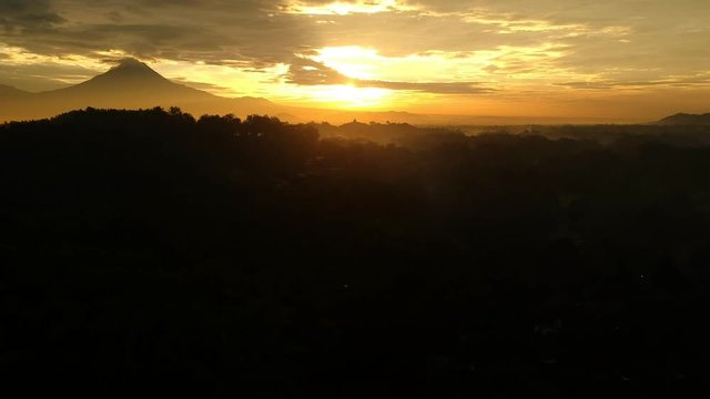 rising golden sun reveals biggest budist temple in the world