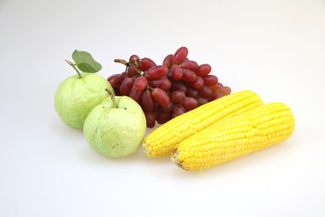 Fresh fruit (guava, corn and grapes) white background