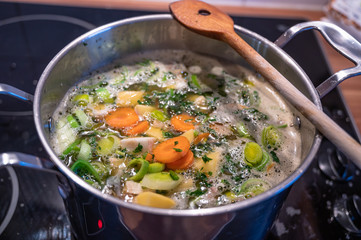 Stew with fresh vegetables cooks in a saucepan