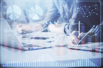 Multi exposure of forex chart with man working on computer on background. Concept of market analysis.