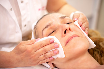 Obraz na płótnie Canvas Cleaning of facial skin and preparing for a face massage
