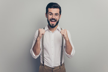 Portrait of crazy delighted collar modern ceo worker man get career development promotion news enjoy raise fists scream yes wear brown outfit isolated over grey color background