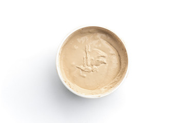 Beige cement grout for filling gaps between the ceramic tiles isolated on white background.