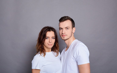 A beautiful young couple in white T-shirts.