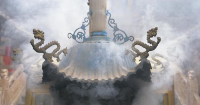 Foggy smoke and incense burner in Temple of NanShan Mountain, Xining Qinghai China.