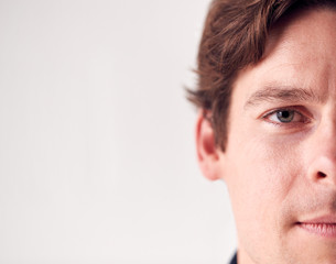 Obraz premium Close Up Portrait Man With Slight Smile Standing In Studio