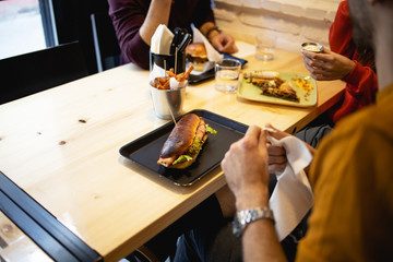 Enjoying the tasty fast food in restaurant
