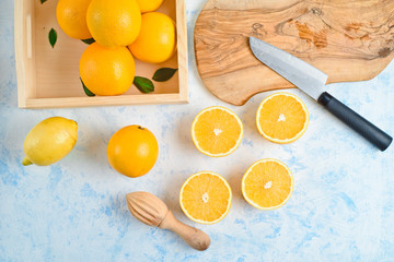 top view of the process of making fresh orange juice, flat lay