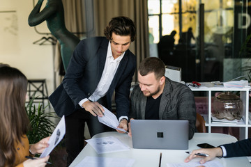 Group of business people brainstorming together in the meeting room. Team work
