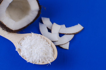 Close-up coconut, coconut shavings and coconut chips on a blue background. . 
