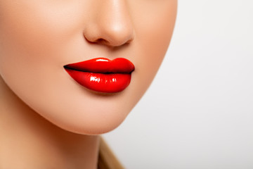 Sexy Red Lips closeup. Beauty Lips with Red Lipstick. Perfect Makeup. Young Woman close up. 
