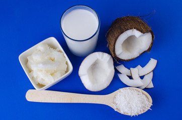 Homemade coconut milk, coconut oil, shavings and chips. The concept of healthy eating