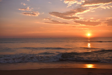 sunset in a sea with beautiful clouds and colorful sky