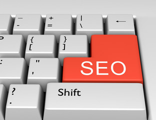 Word SEO is written on a computer keyboard. Conceptual image on a computer key Enter