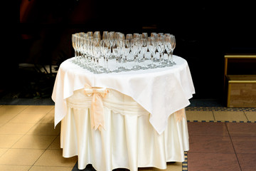 Table with champagne glasses, prepared for celebration