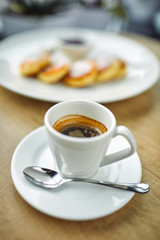 breakfast in the cafe - coffee and cottage cheese pancakes