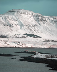 Amazing snowy mountains and turquoise water in Westerrn Iceland