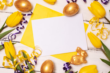 Happy Easter. Congratulatory easter background. Easter eggs and flowers.