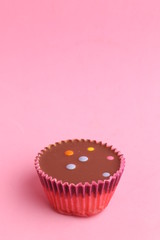 Chocolate cupcake with pink paper