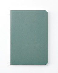 Top view of closed stitch blank recycled paper cover notebook on white background.