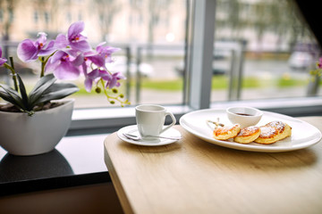 breakfast in the cafe- coffee and cottage cheese pancakes