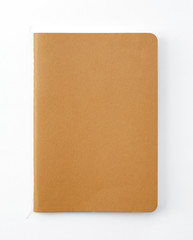 Top view of closed stitch blank recycled paper cover notebook on white background.