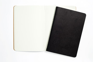 Top view of open stitch blank recycled paper cover notebook on white background.
