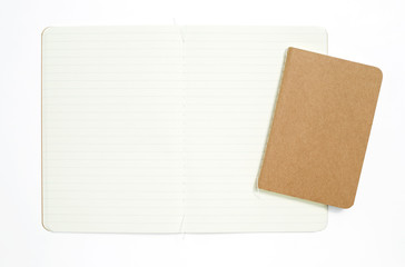 Fototapeta premium Top view of open stitch blank recycled paper cover notebook on white background.