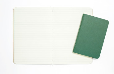 Top view of open stitch blank recycled paper cover notebook on white background.