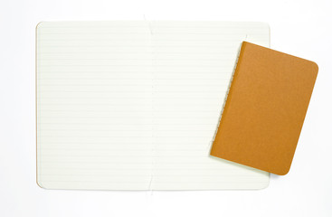 Top view of open stitch blank recycled paper cover notebook on white background.