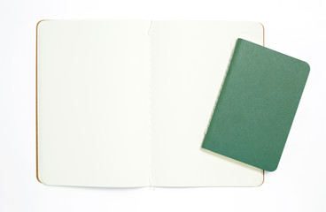 Top view of open stitch blank recycled paper cover notebook on white background.