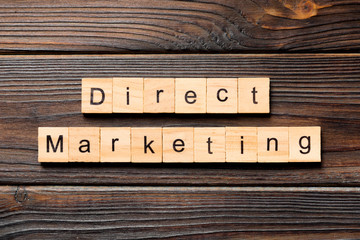 Direct marketing word written on wood block. Direct marketing text on wooden table for your desing, concept