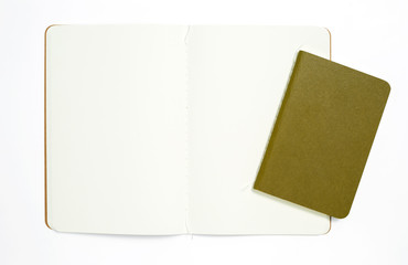 Top view of open stitch blank recycled paper cover notebook on white background.