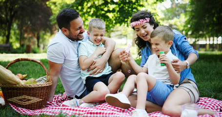 Young family with children having fun in nature