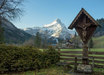 Fototapeta na wymiar Winter landscape with beautiful high mountains in Johnsbach village in The Gesause National Park, in Styria region, Austria