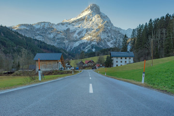 Road with beautiful mountain view in Johnsbach village in The Gesause National Park, in Styria...