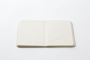 Top view of open stitch blank recycled paper cover notebook on white background.