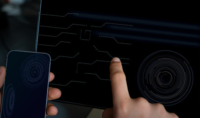 close up hi tech tablet & cell phone with hands.