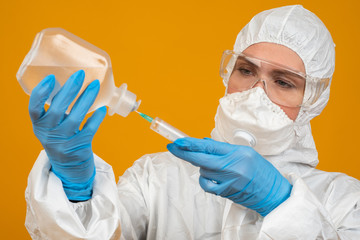 Epidemiologist. Laboratory assistant in a protective case. Concept - the study of dangerous...