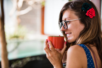 Woman enjoying coffee / tea at home.