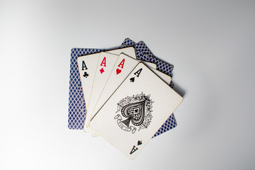 Four aces on a table. Poker winning hand. Playing cards and winning at poker.