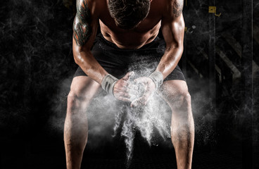 Muscular man clapping hands and preparing for workout at a gym. Sport poster.