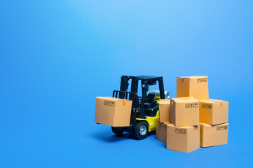 Forklift truck with cardboard boxes. Transportation logistics infrastructure, import and export...