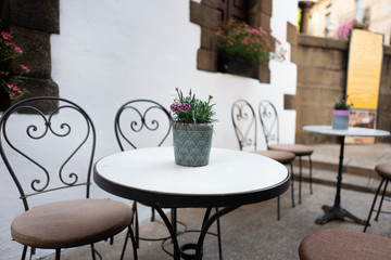 Fototapeta na wymiar fragment of a cafe on a street of Barcelona. Catalonia