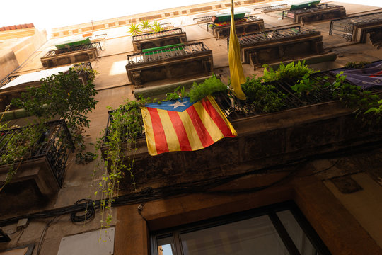 Flag of Catalonia on a building in Barcelona, Spain