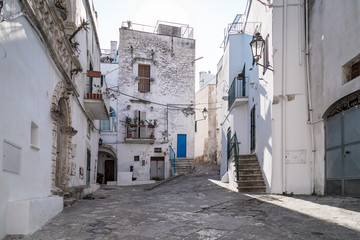 Historic center of white city of Ostuni in Puglia, in a day of August