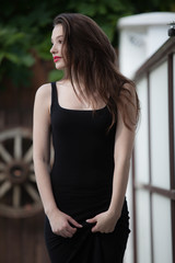 Portrait of beautiful young girl in summer garden.