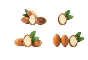Argan oil isolated. Argan seeds with oil on a white background. Natural bio cosmetics and oils for skin and hair care from Morocco