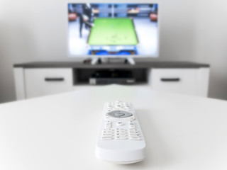 TV with white screen on a stand in the room.